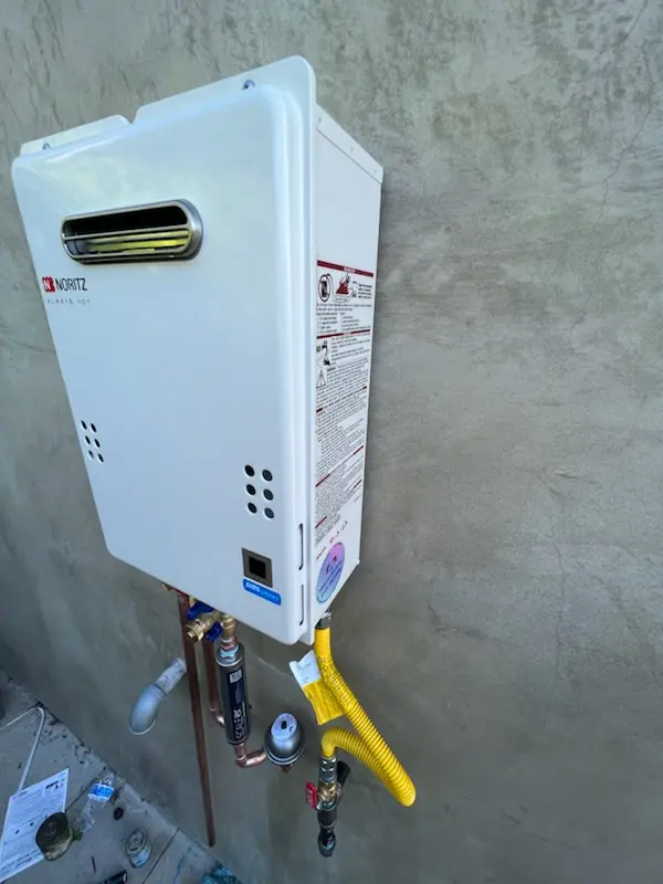 Tankless water heater installation for The Cloisters at Charles homes